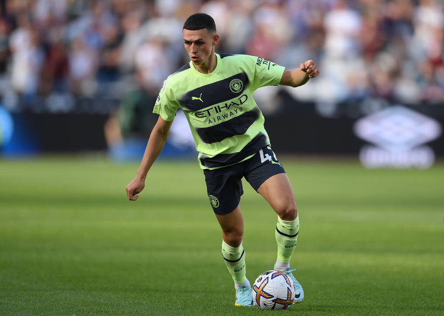 Phil Foden In Yellow-green Jersey Wallpaper