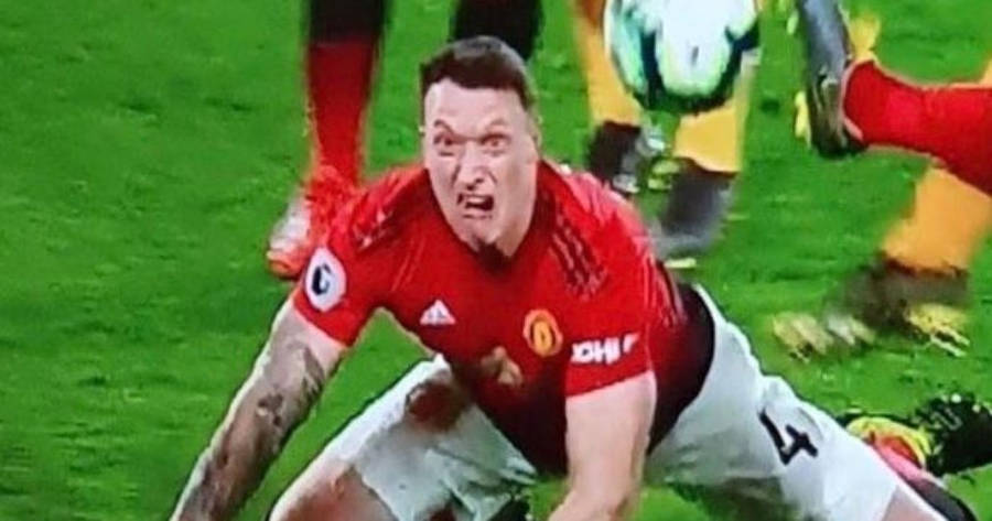 Phil Jones In Action On The Football Field Wallpaper