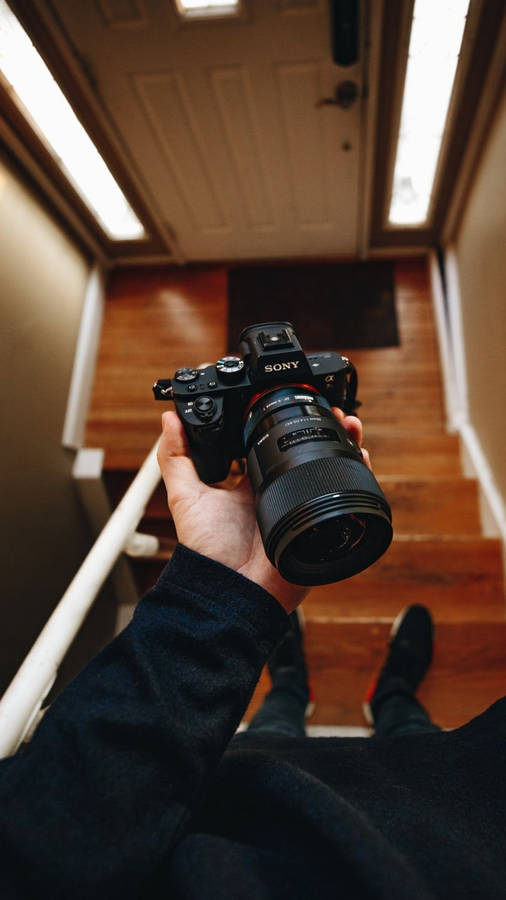 Photographer On Stair Wallpaper