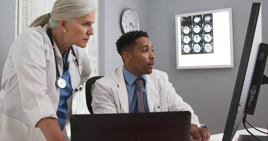 Physicians Examining X-ray Wallpaper