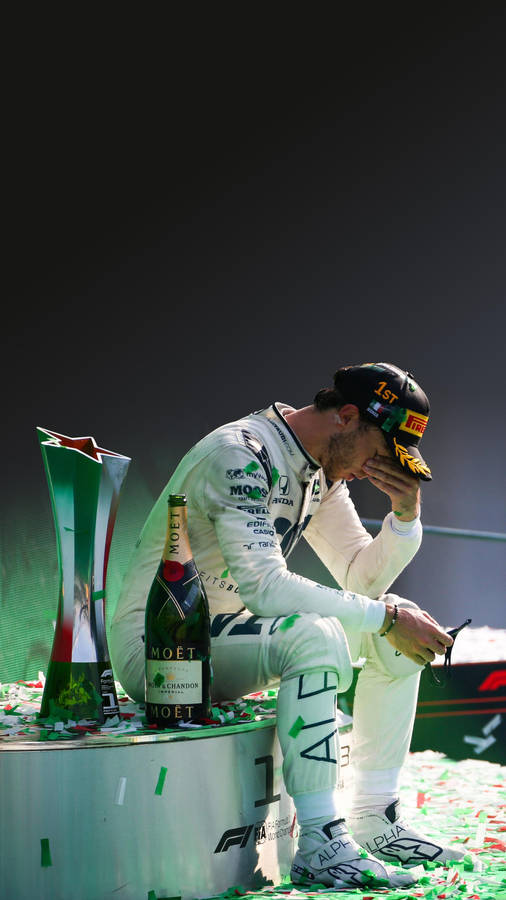 Pierre Gasly, A Master Of The Formula One Racetrack, Covering His Eyes Wallpaper