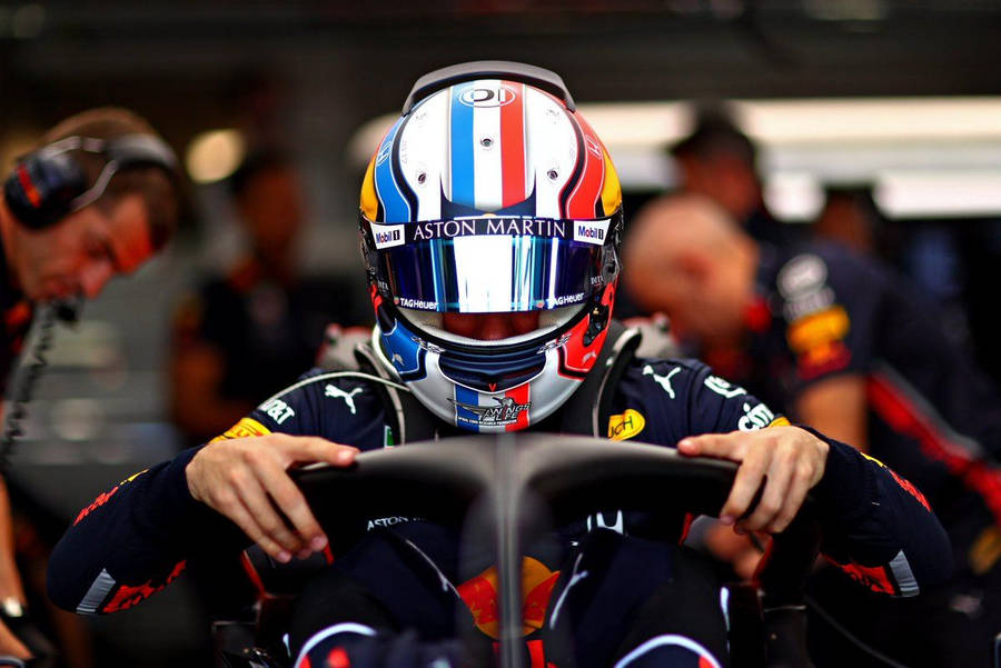 Pierre Gasly Gripping The Halo Of His Race Car Wallpaper