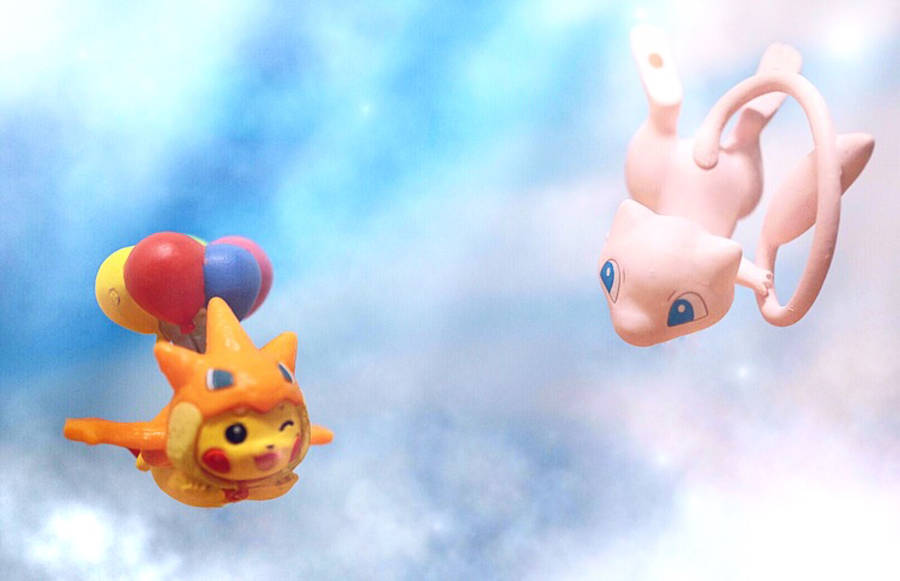 Pikachu And Mew Sailing And Playing Together In The Sky Wallpaper