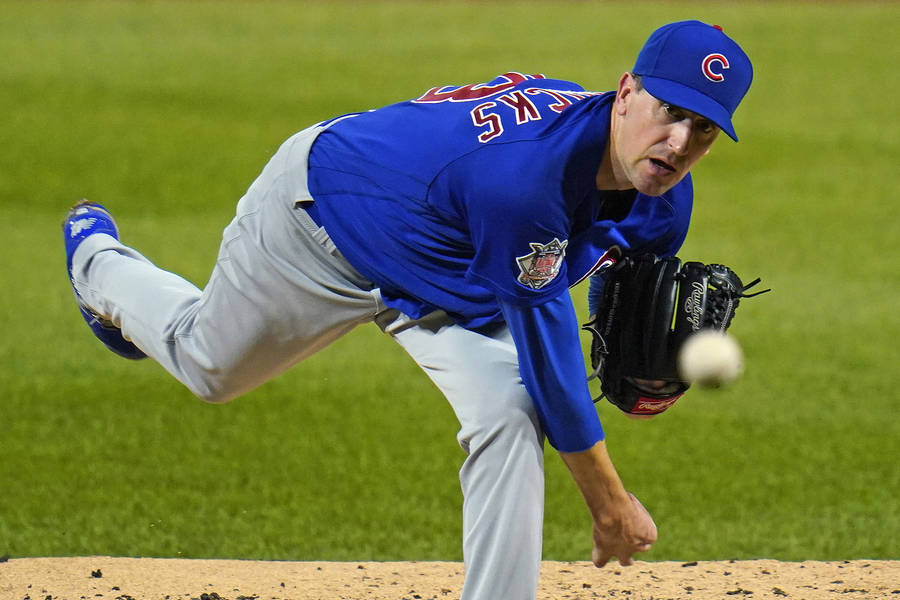 Pitcher Kyle Hendricks Throwing A Baseball Wallpaper