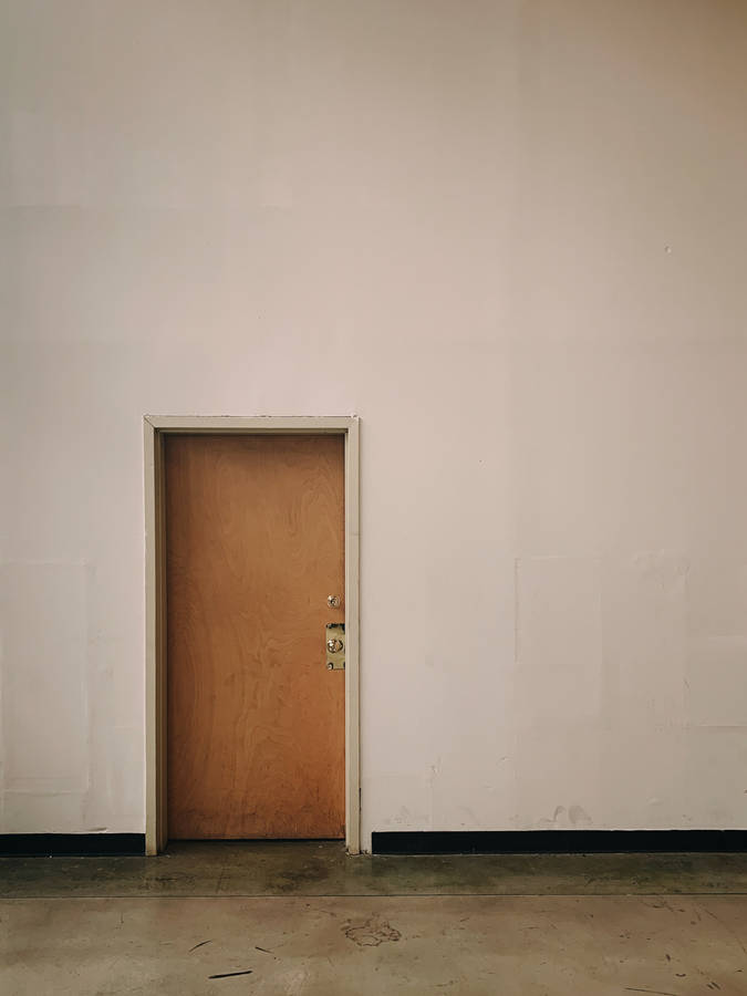 Plain Brown Wooden Door Inside A Structure Wallpaper