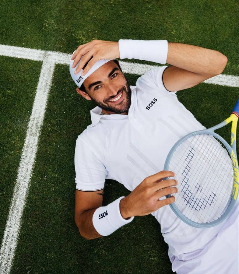 Playful Matteo Berrettini Top View Wallpaper