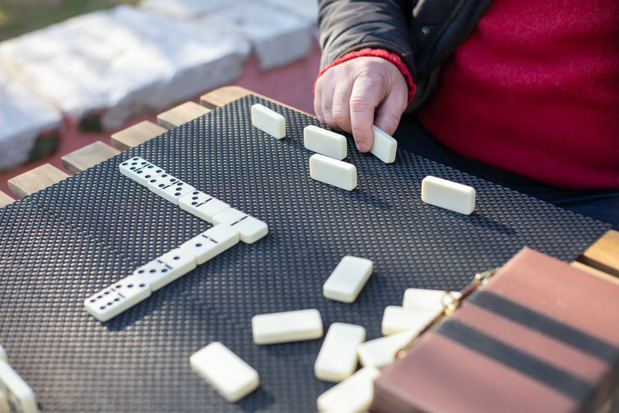 Playing Dominos On Table Wallpaper