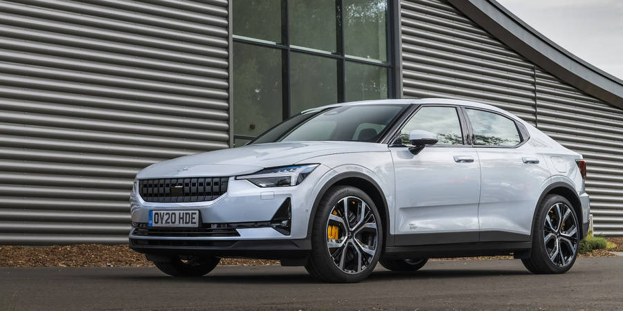 Polestar 2 Parked By A Modern Home Wallpaper