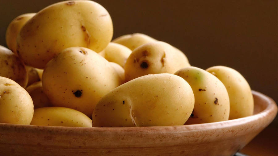 Potatoes Served On A Wooden Bowl Wallpaper