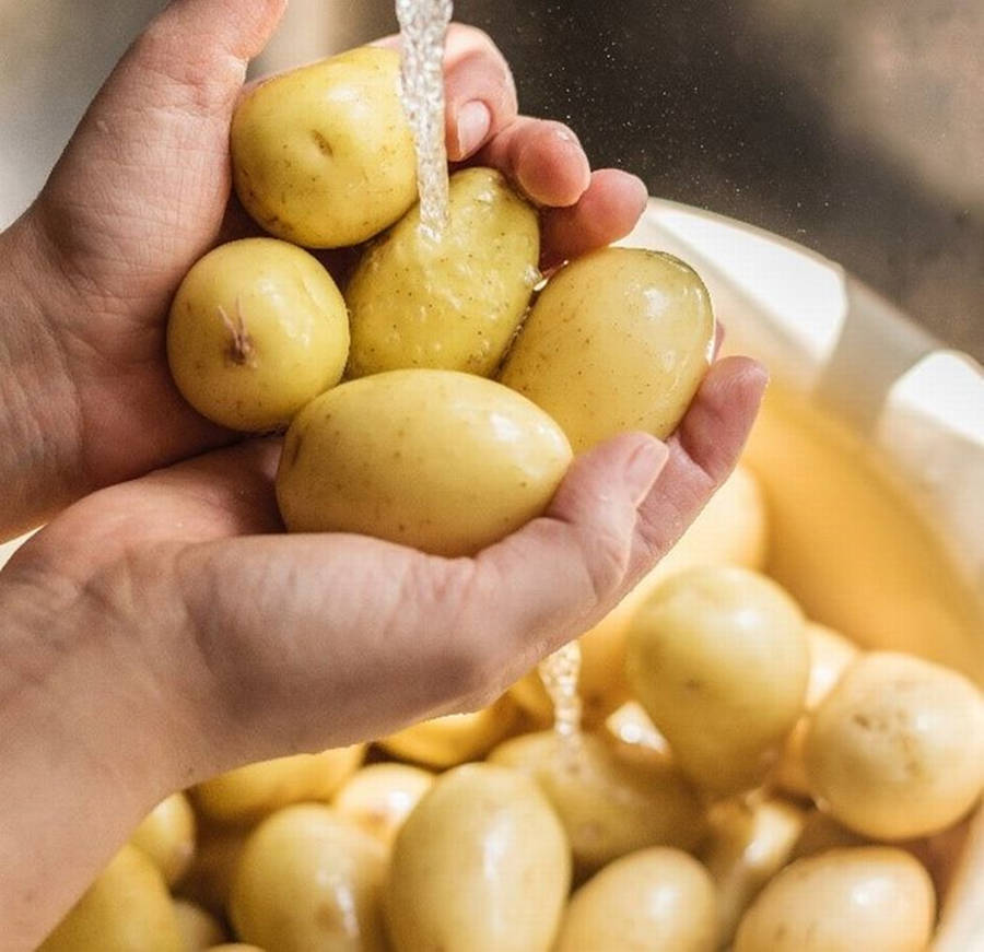 Potatoes Under Running Water Wallpaper