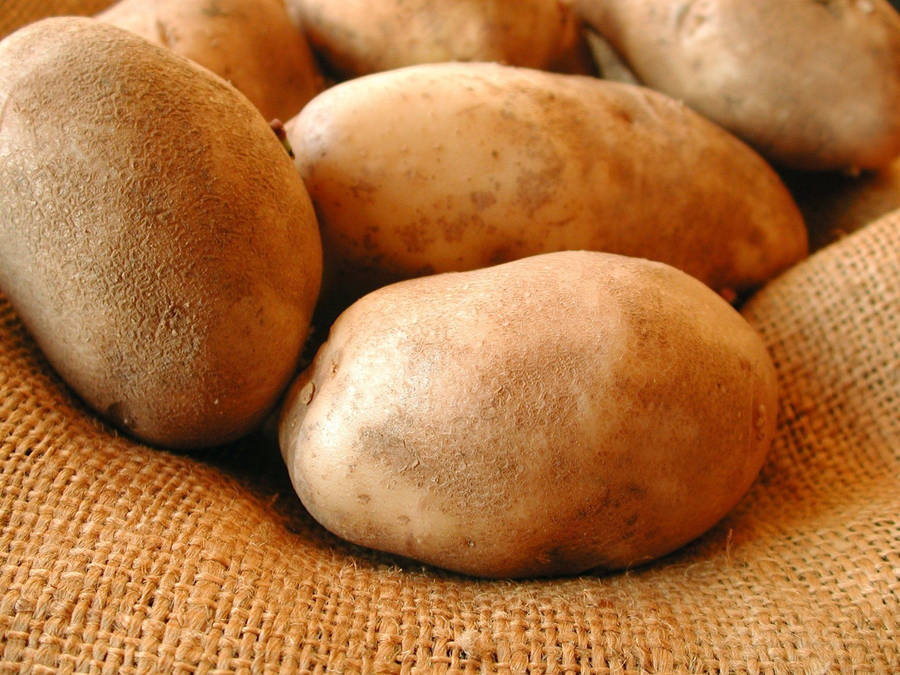 Potatoes With Dust On A Burlap Wallpaper