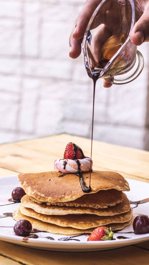 Pouring Chocolate On Pancakes Wallpaper