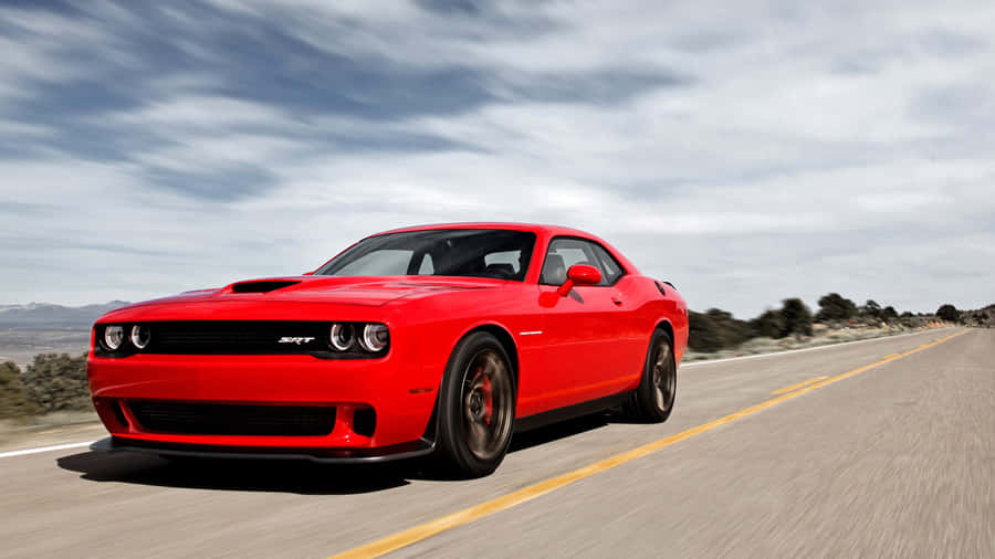 Power And Speed - Red Dodge Hellcat In The Spotlight Wallpaper