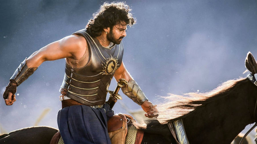 Prabhas Hd Baahubali Riding A Horse Wallpaper