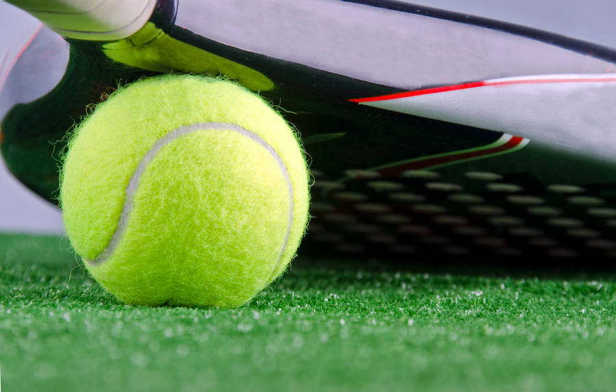 Precision In Details - Close-up Shot Of Tennis Ball Wallpaper