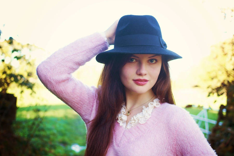 Pretty Woman Wearing A Black Bucket Wallpaper