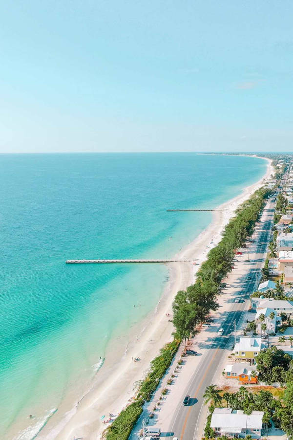 Pristine Florida Beach With White Sands And Turquoise Waters Wallpaper