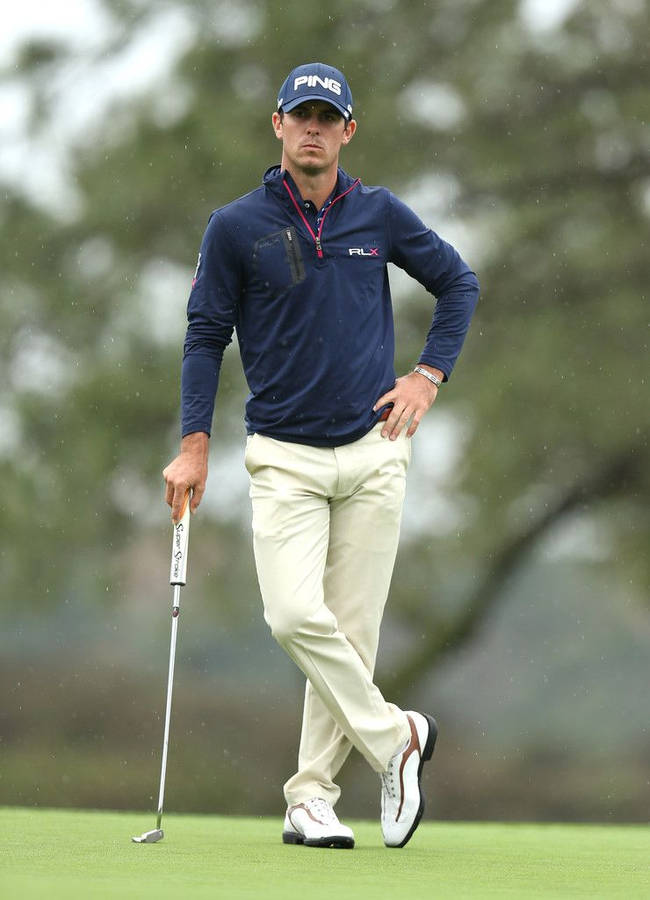 Professional Golfer Billy Horschel Showing His Elegant Stance With Crossed Legs. Wallpaper