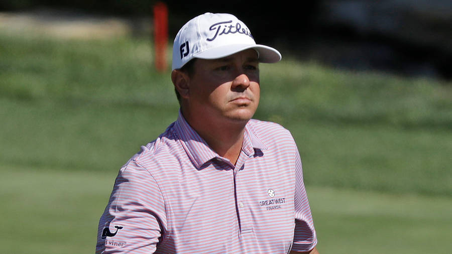 Professional Golfer Jason Dufner Focusing Intensely During A Match Wallpaper