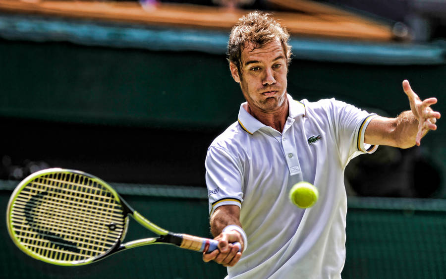 Professional Tennis Player Richard Gasquet Elegantly Hitting An Incoming Ball Wallpaper