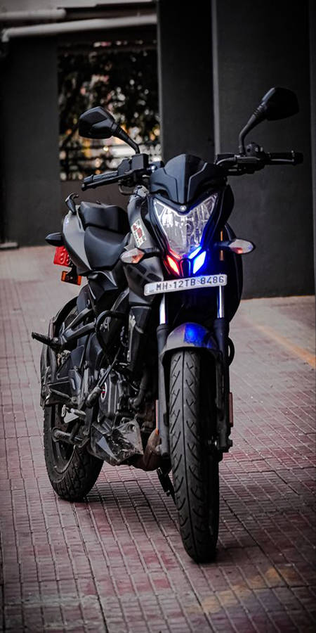 Pulsar 150 Beside Building Wallpaper