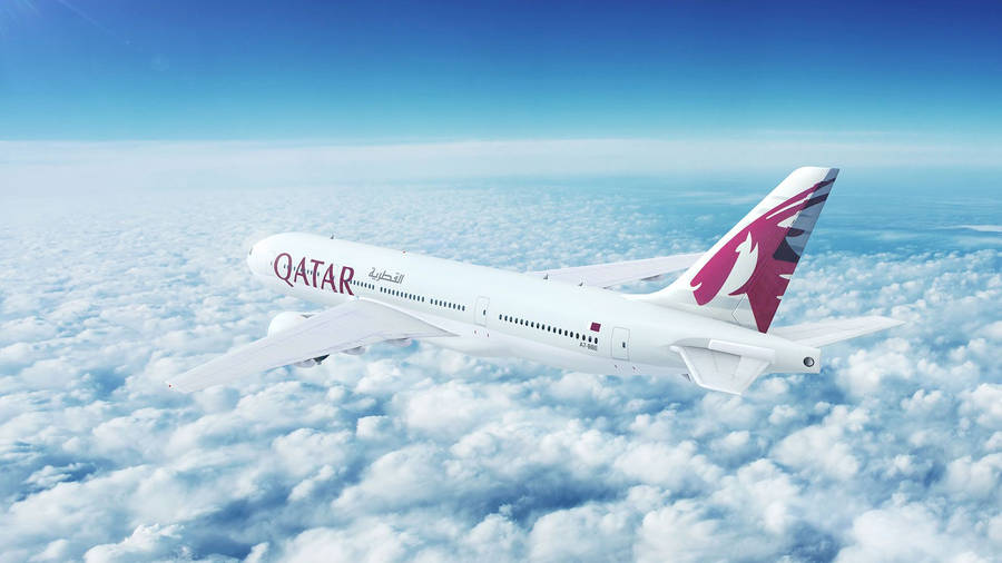 Qatar Airways Above A Fluff Of A Cloudy Sky Wallpaper