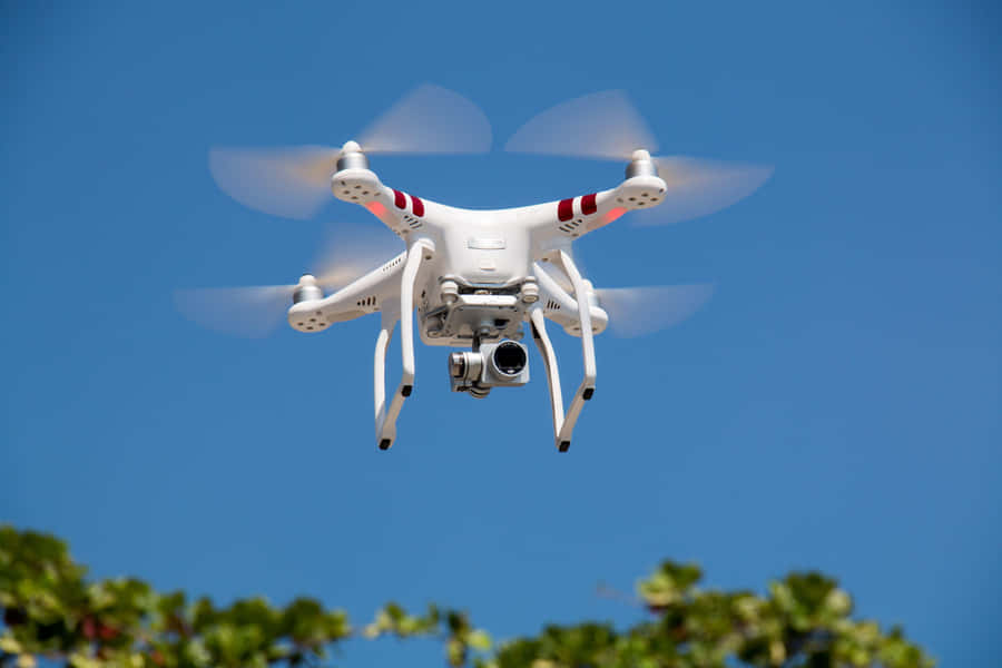 Quadcopter Drone In Flight Wallpaper