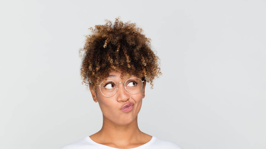 Quirky African Woman Looking Up Wallpaper