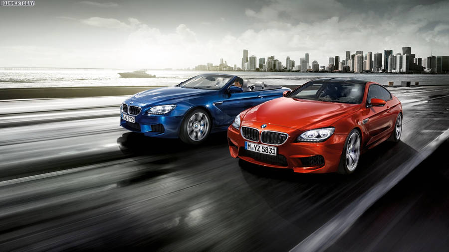 Race Between Red And Blue Bmw Wallpaper