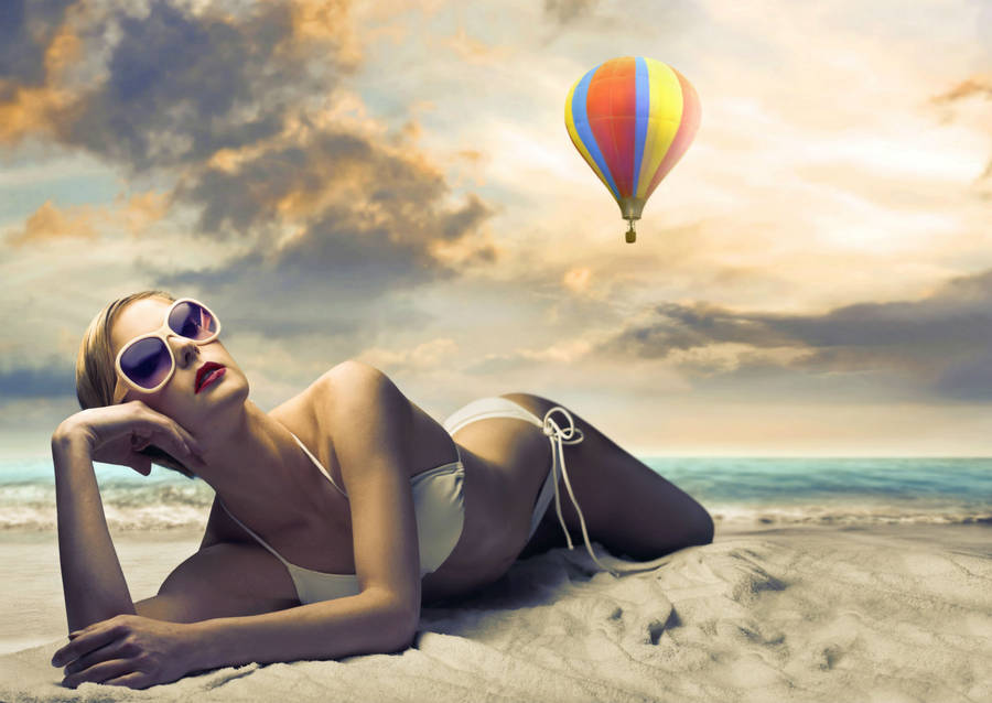 Radiant Beauty Under The Sky - Bikini Girl By Hot Air Balloon Wallpaper