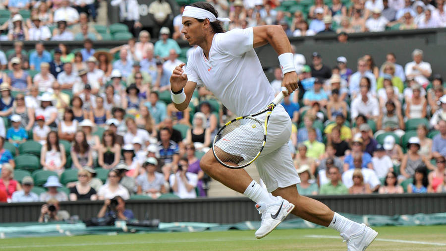 Rafael Nadal Running Across Field Wallpaper