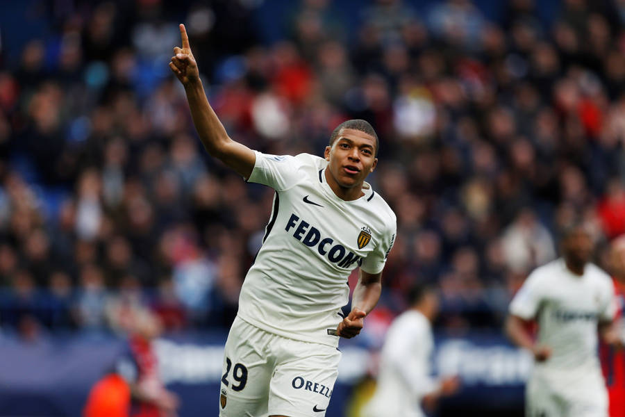 Raising Hand Kylian Mbappe Wallpaper