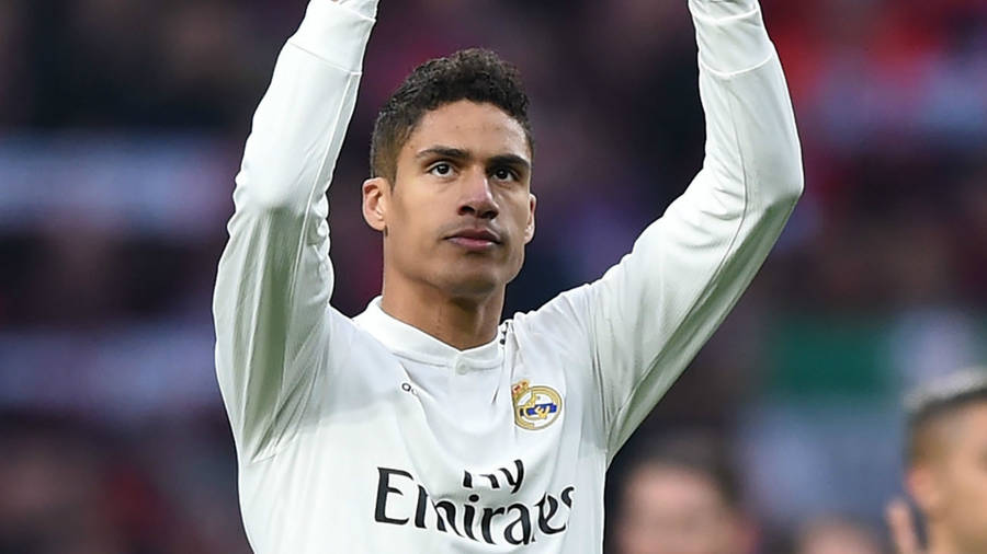 Raphael Varane Hands Raised Wallpaper