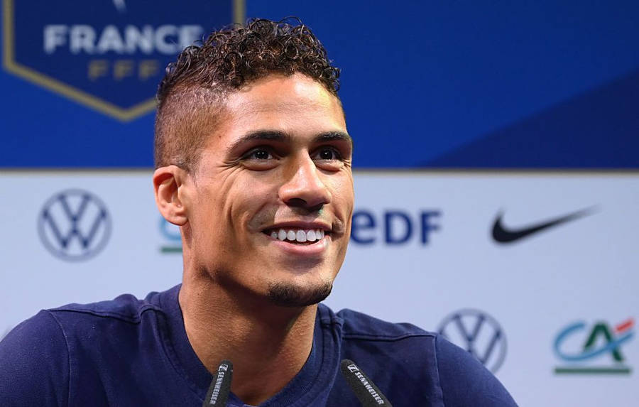 Raphael Varane Interview Brand Logos Wallpaper