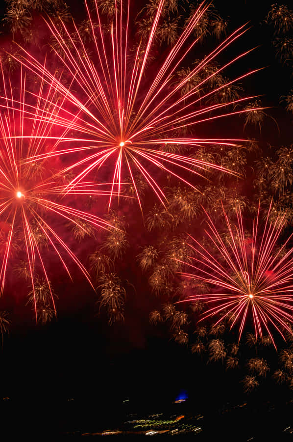 Red And Orange Fireworks Display Wallpaper