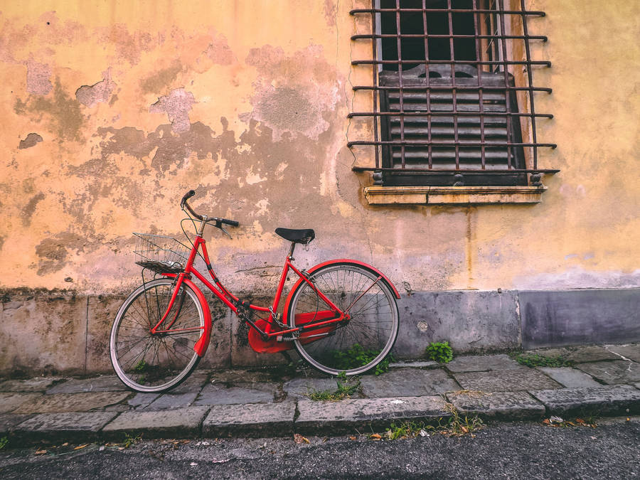 Red Bike Beside Wall Wallpaper