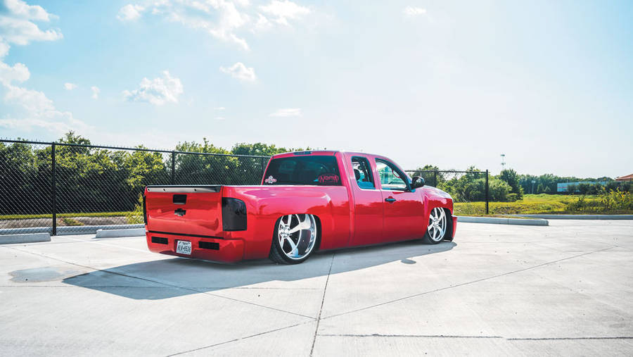 Red Dropped Truck On Concrete Wallpaper