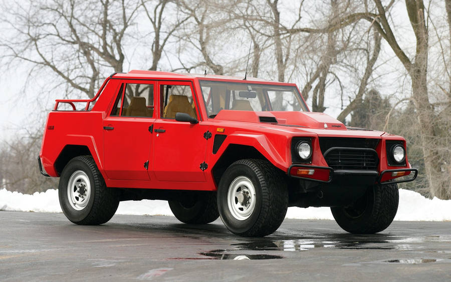 Red Lambo Truck At Snow Wallpaper