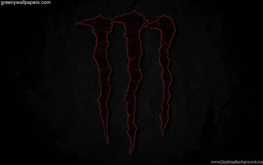 Red Monster Logo Illuminated On Dark Screen Wallpaper