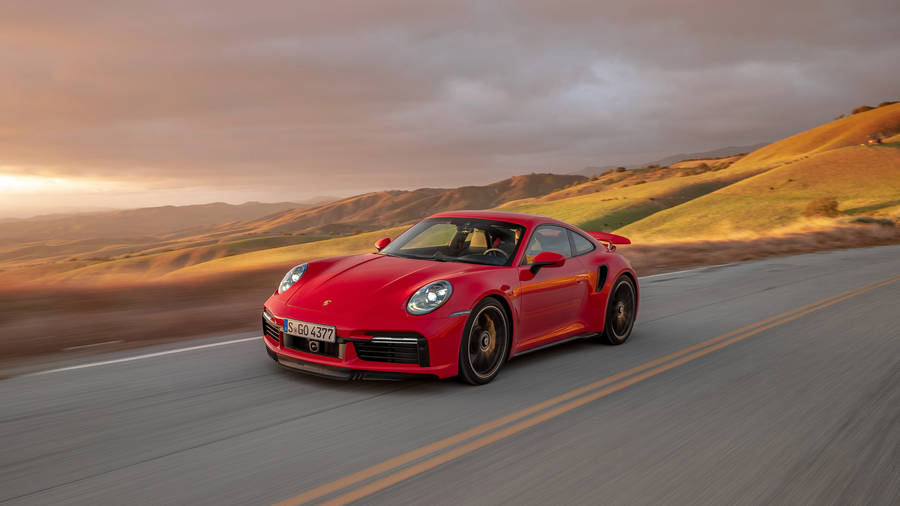 Red Porsche 911 In Empty Road Wallpaper