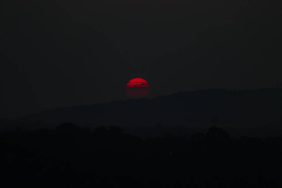 Red Sun On Black Tablet Wallpaper