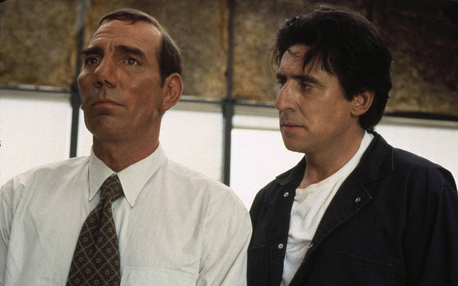 Renowned Actors Pete Postlethwaite And Gabriel Byrne In A Scene Wallpaper