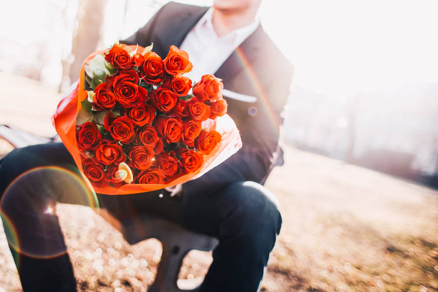 Resplendent Bouquet Of Red Roses On Red Screen Wallpaper