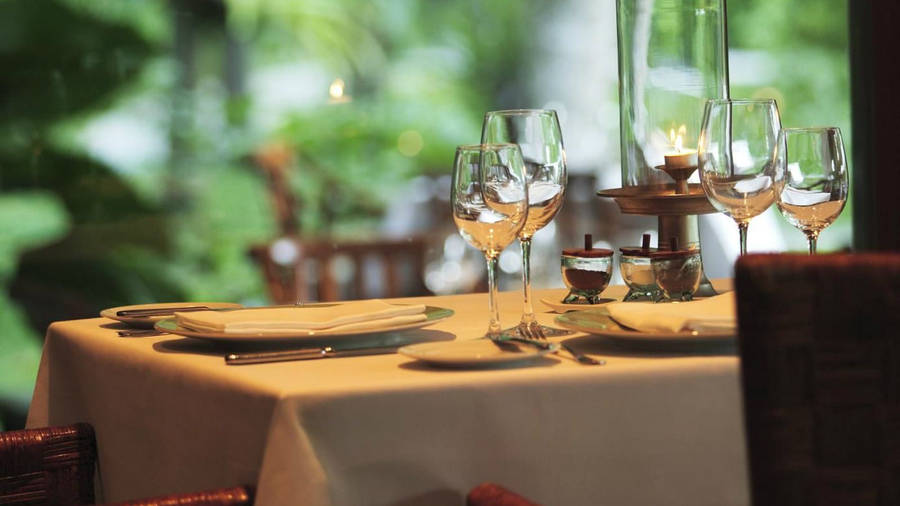 Restaurant Table Setting With Candlelight Wallpaper