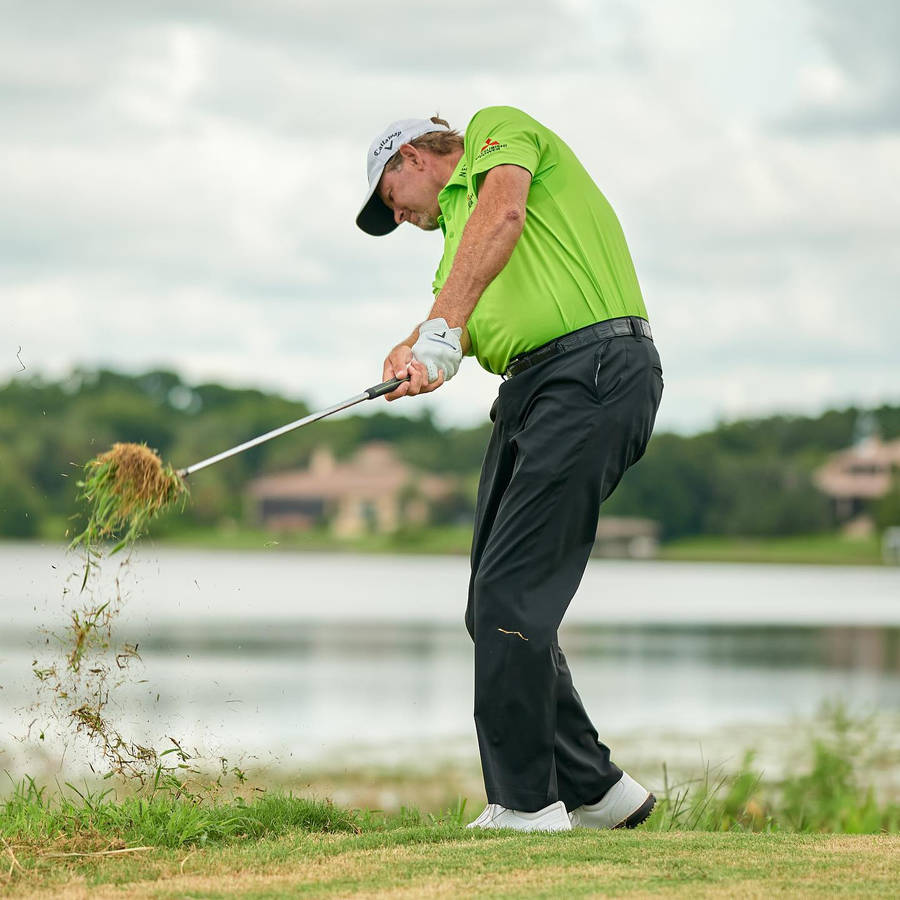 Retief Goosen Hitting A Divot Wallpaper