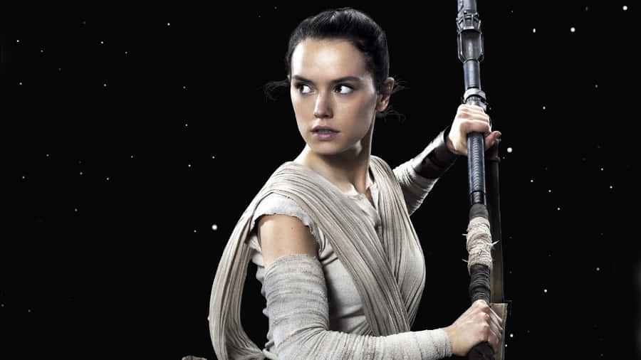 Rey Battles Kylo Ren In An Intense Showdown In Star Wars. Wallpaper