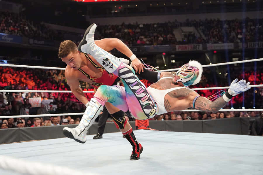 Rey Mysterio In Action Wrestling Match Wallpaper