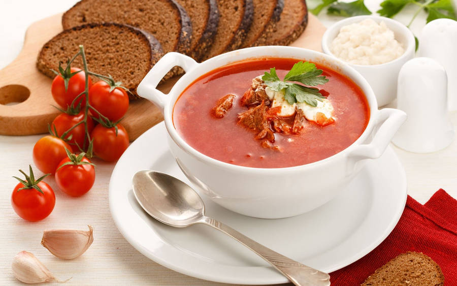 Rich And Hearty Traditional Ukrainian Borscht Soup On A Rustic Wooden Table. Wallpaper