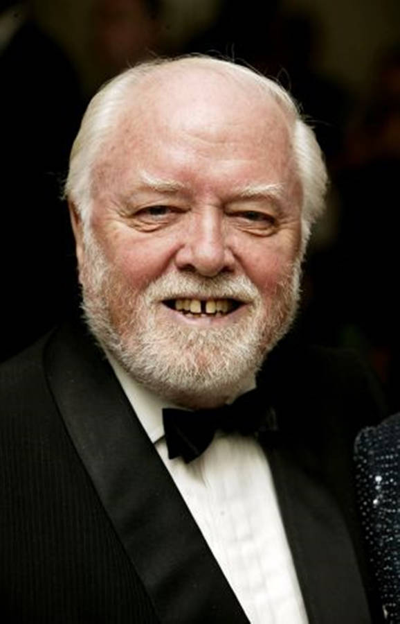 Richard Attenborough In Tuxedo Black Background Wallpaper