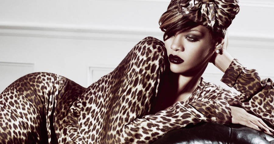 Rihanna In Leopard Outfit Sepia Wallpaper
